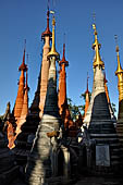 Inle Lake Myanmar. Indein, on the summit of a hill the  Shwe Inn Thein Paya a cluster of hundreds of ancient stupas. Many of them are ruined and overgrown with bushes.